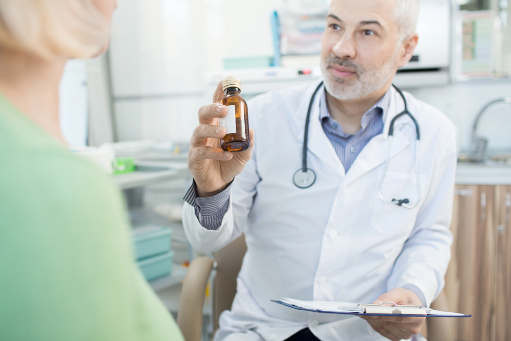 Doctor explaining how PTSD medication works to patient