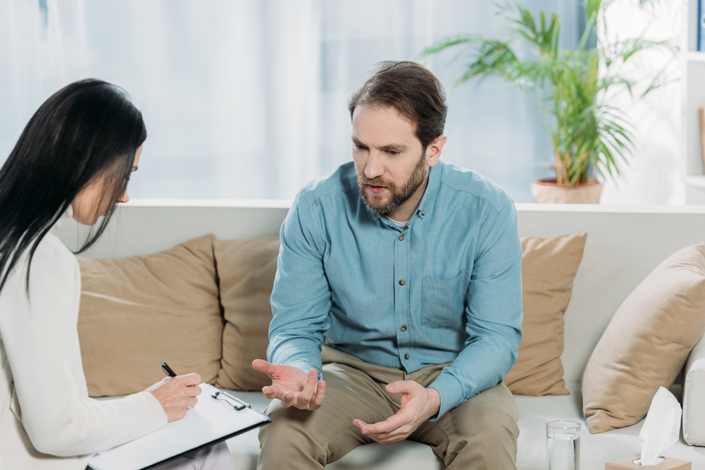 man with complex ptsd getting treatment with psychologist