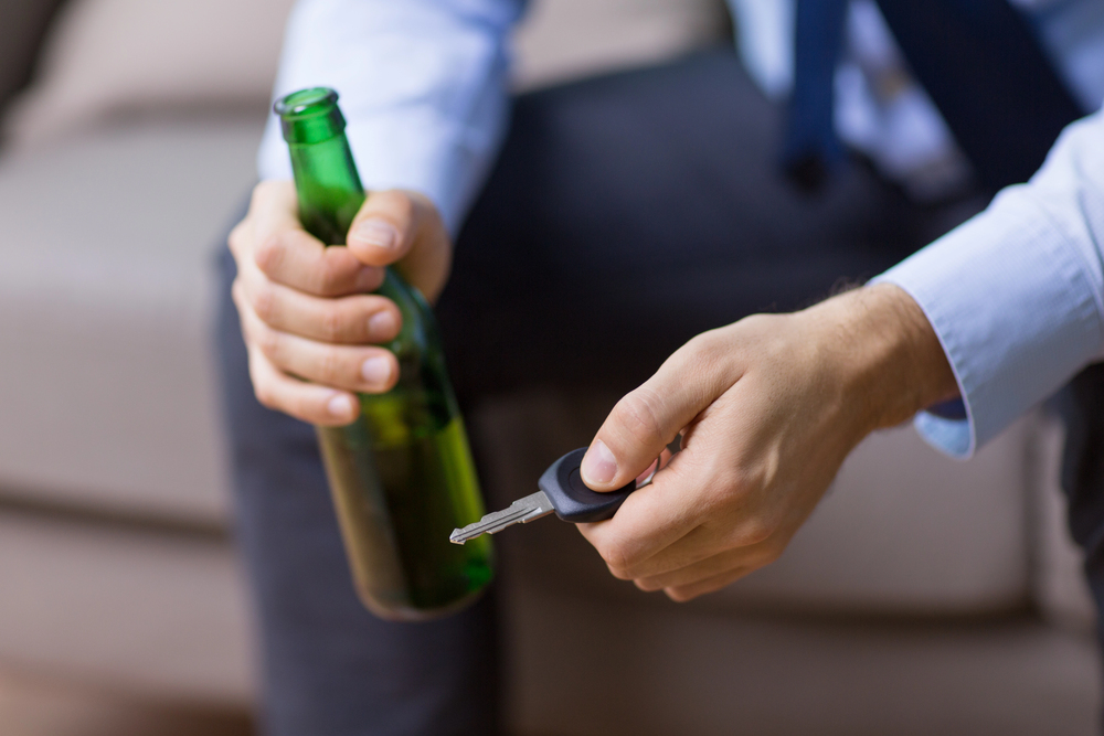 man thinking of driving under the influence of alcohol