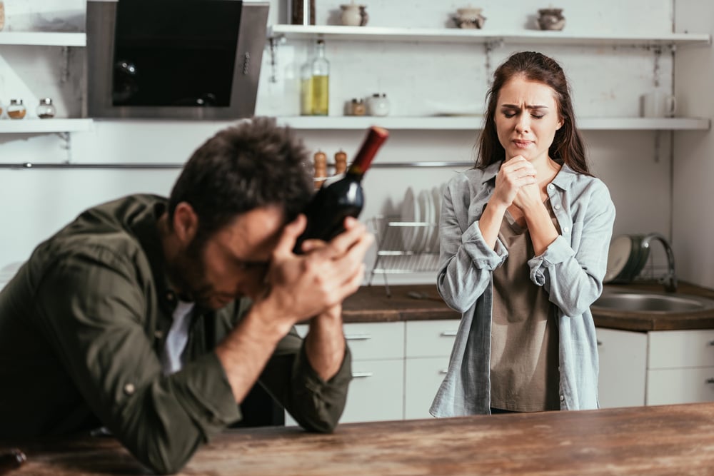 husband and wife fighting because of alcohol abuse