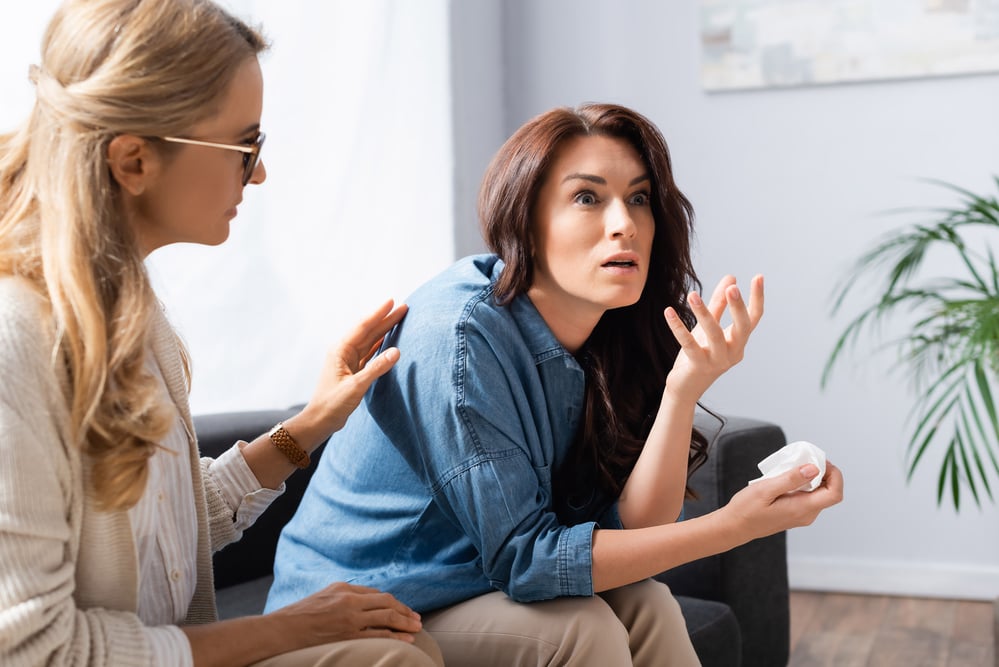 therapist calming her patient who is having a ptsd attack