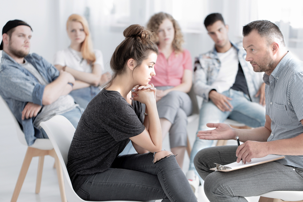 members of group therapy help each other to deal with anxiety and depression