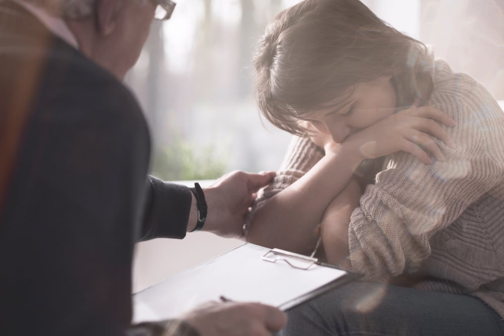 therapist Helping Someone with Depression