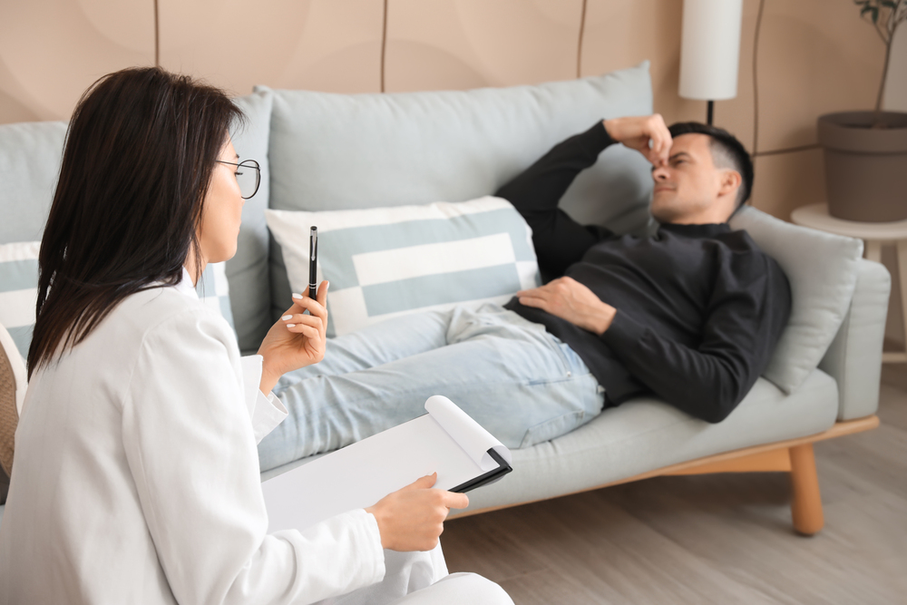 Psychologist working with patient in residential rehab