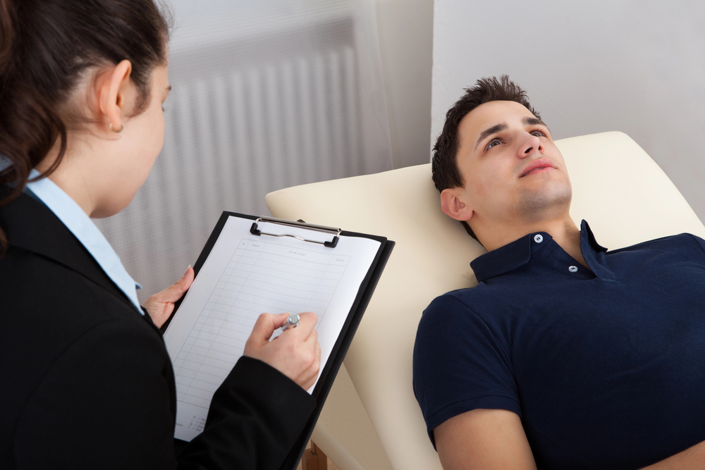 alcoholic man with high blood pressure is allowed to rest and lie down by his therapist