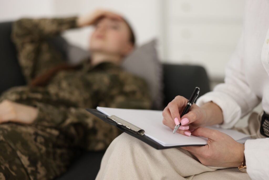 Psychotherapist working with military woman in office