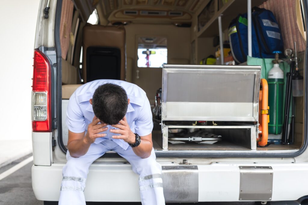 picture of a paramedic looking tired 