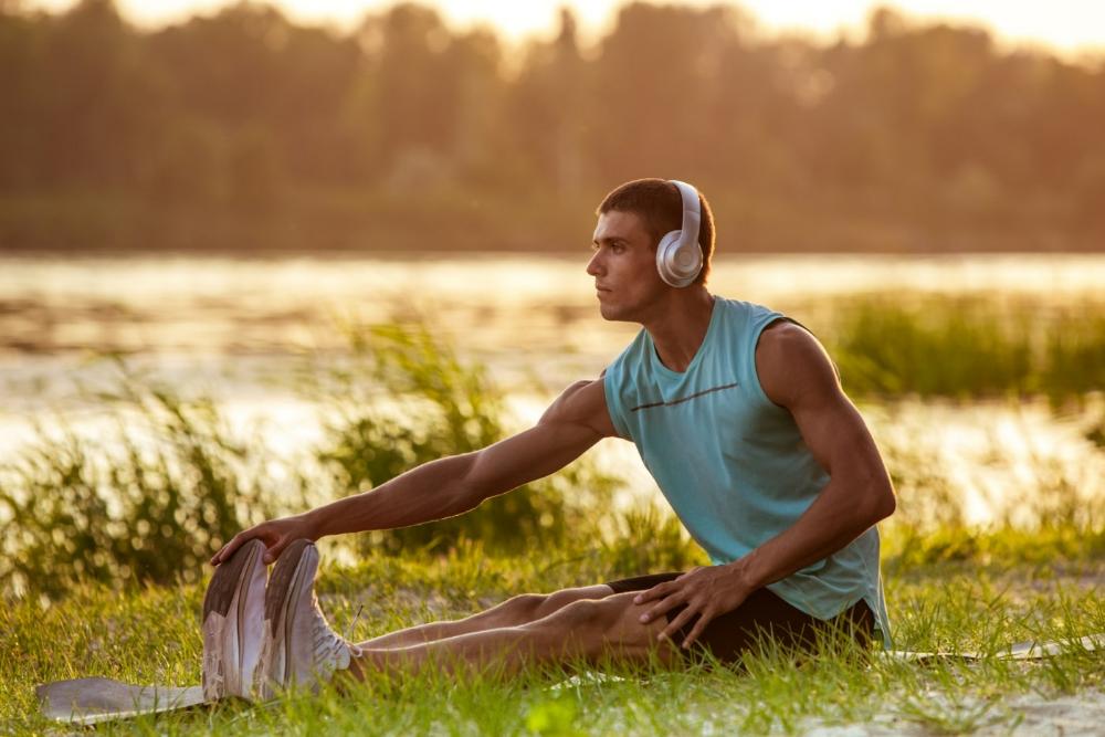 young man outdoor exercise with headphone on