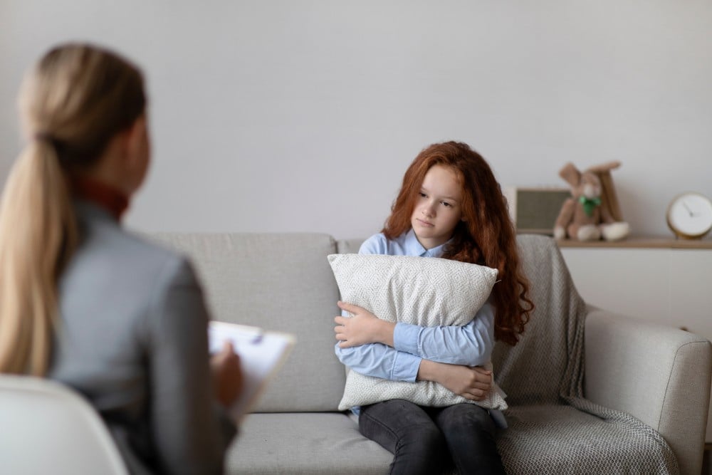 teen having trauma in a therapy session