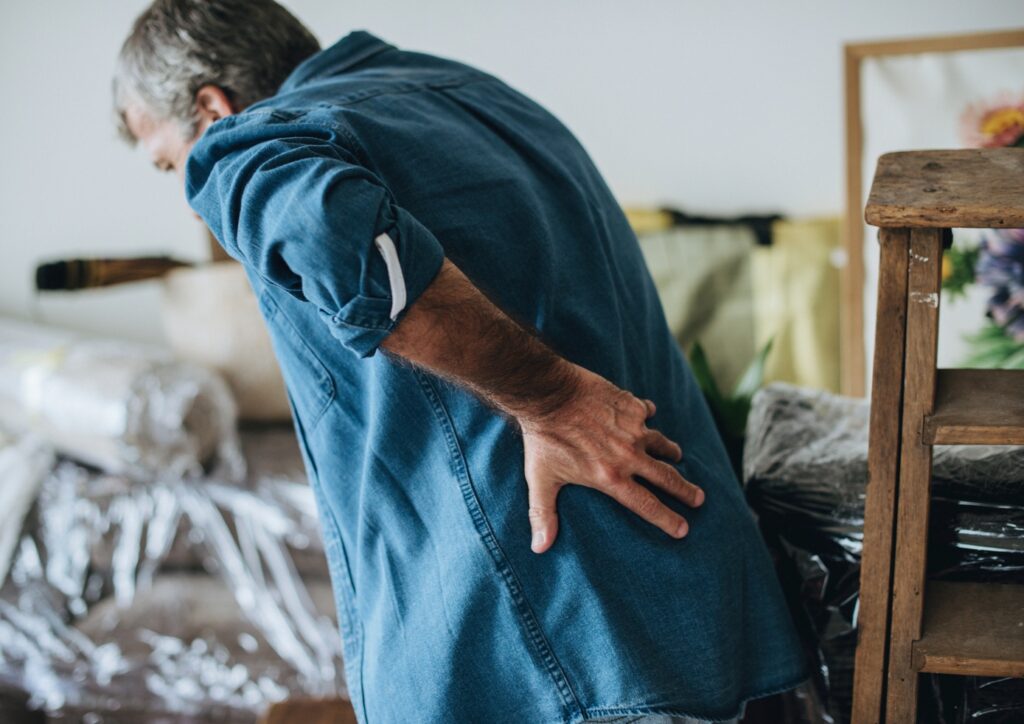 Senior man having back pain probably cause osteoporosis