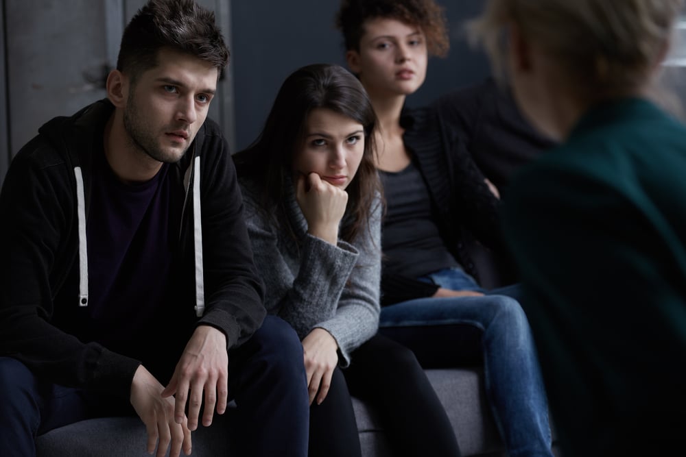 Young people addicted to drugs participating in group therapy