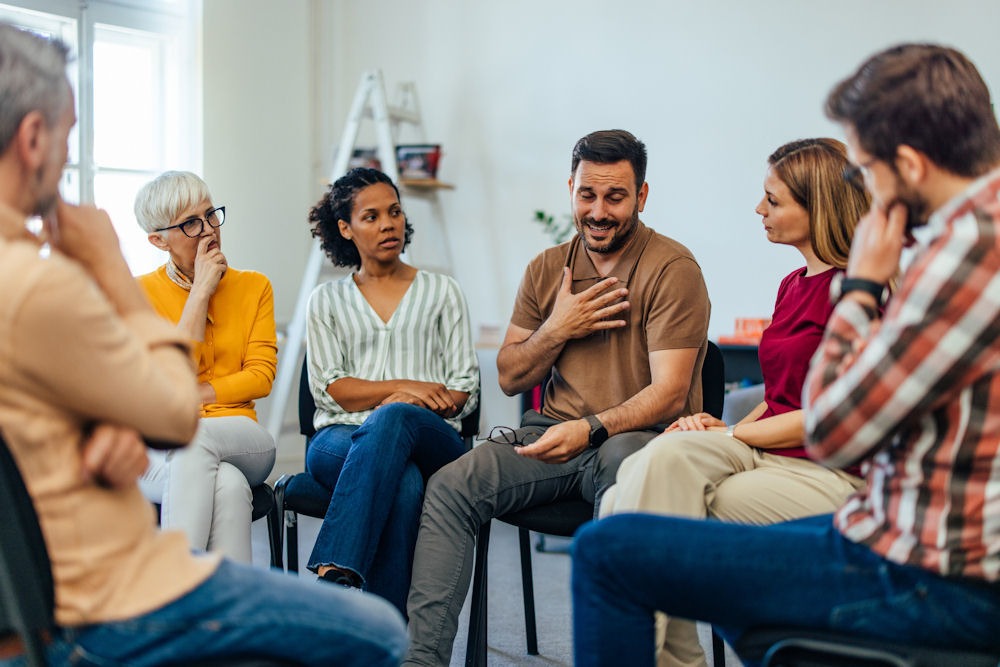 sad man sharing during group session