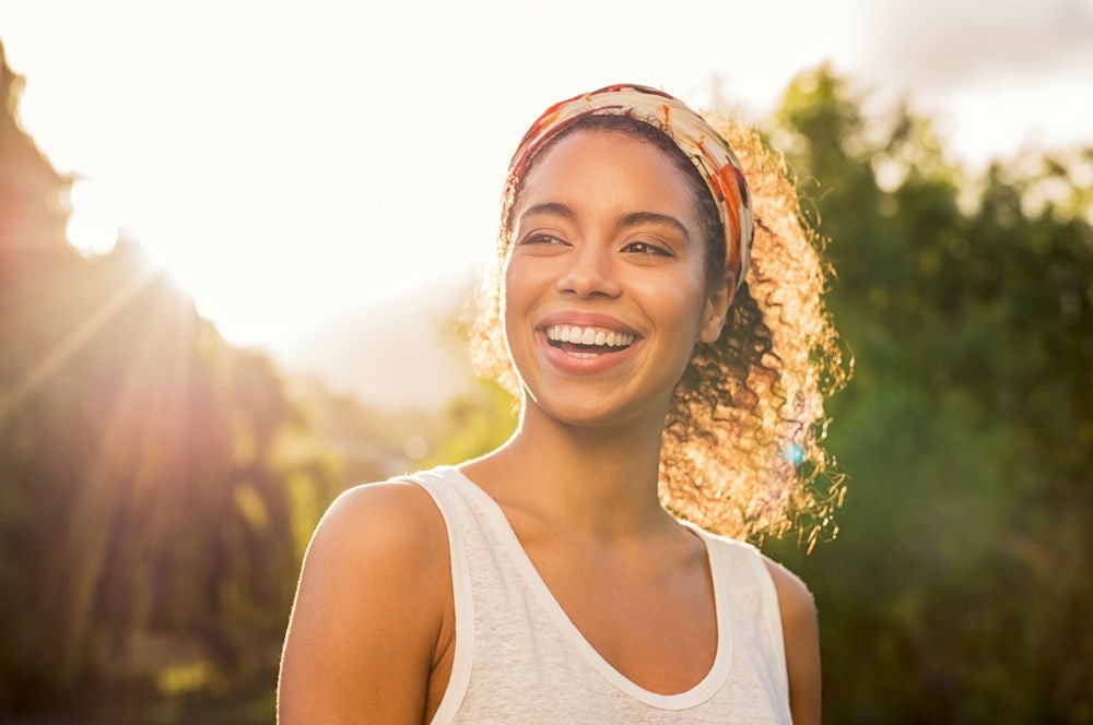 woman outside and smiling