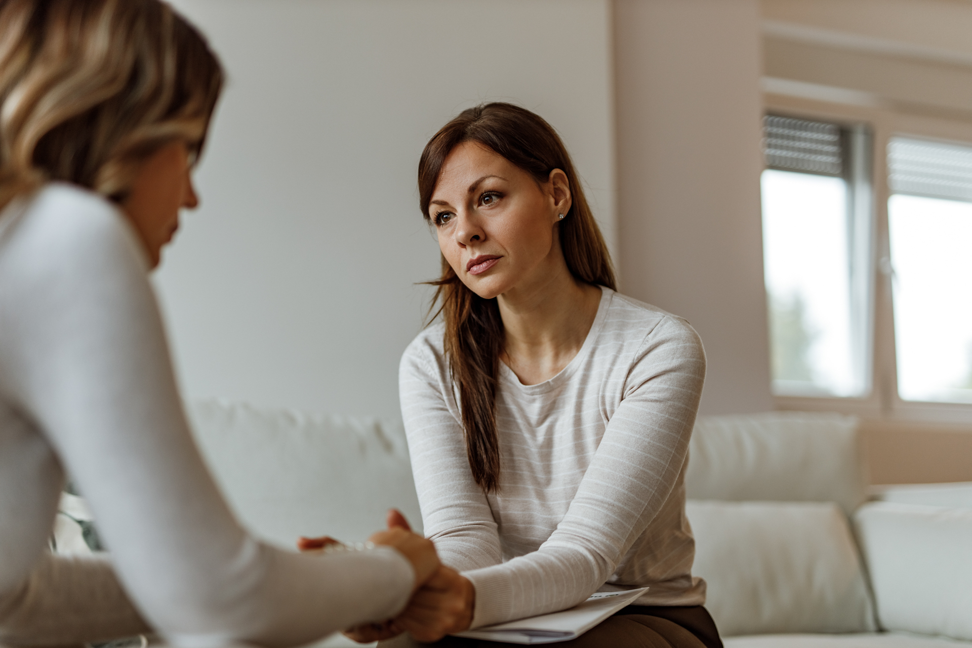 woman in therapy sitting on couch