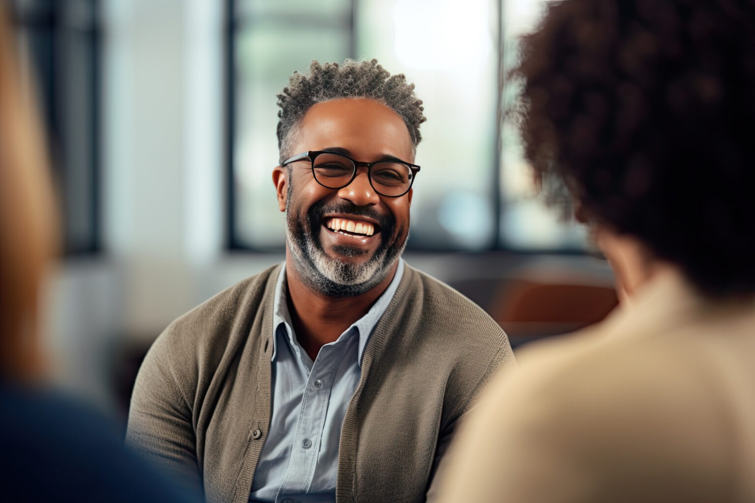 man smiling in therapy