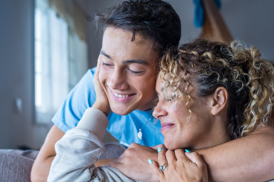 woman hugging son in recovery