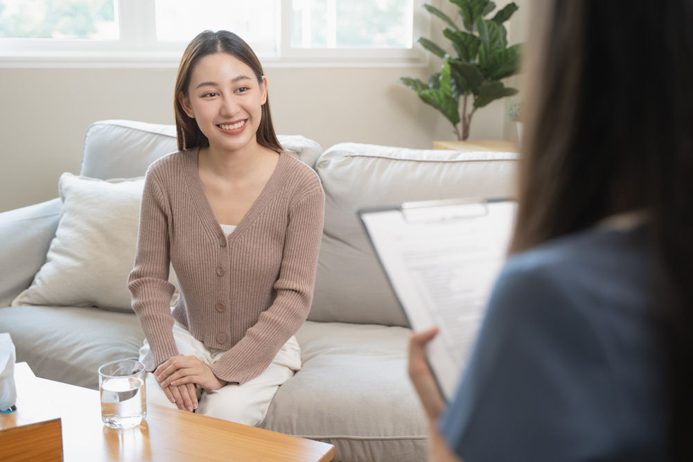 happy woman in individual therapy