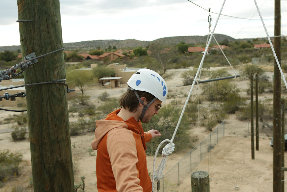 man doing ropes course at Sabino Recovery