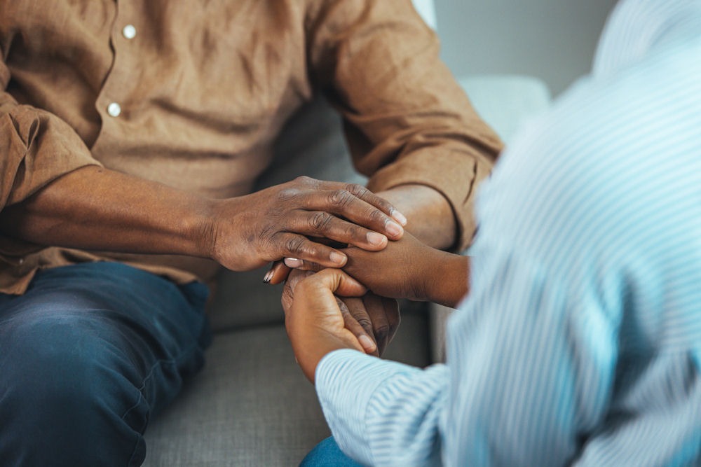 therapist comforting a patient