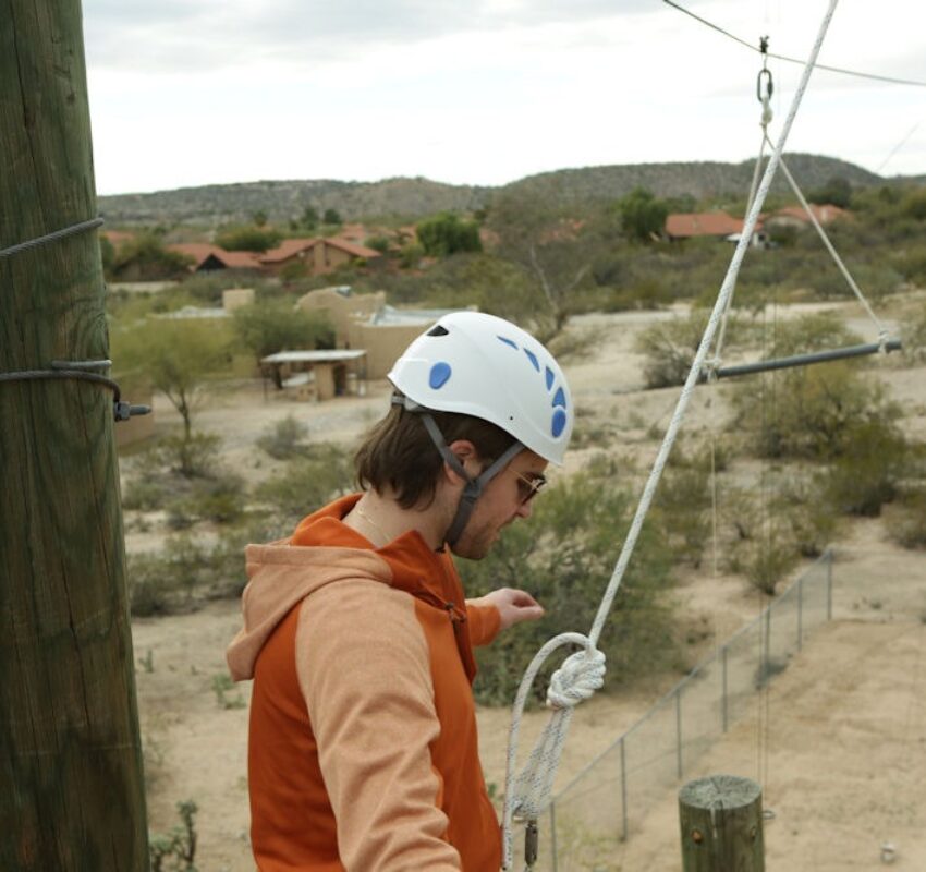 man doing ropes course at Sabino Recovery